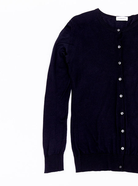 Flat lay of women's navy blue long sleeve cardigan knit in a luxury and premium sea island cotton.